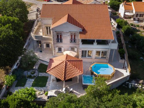 an aerial view of a house with an orange roof at Holiday Home Rajna in Pražnice