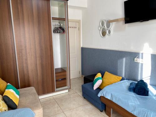 Ένα ή περισσότερα κρεβάτια σε δωμάτιο στο Cozy apartment on Banana beach