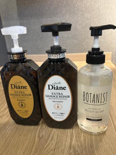 three bottles of soap sitting on top of a table at IKEBUKURO TOKIWA 10 BUILDING 6min walk from Ikebukuro Station Direct access to the airport in Tokyo
