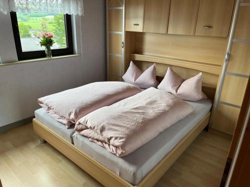 Postel nebo postele na pokoji v ubytování Ferienhaus am Hennesee