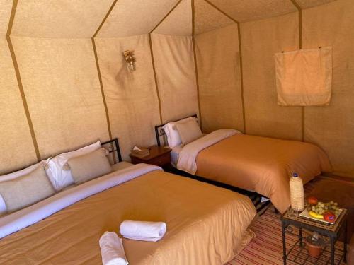 Un ou plusieurs lits dans un hébergement de l'établissement Blue Sky Luxury Camp