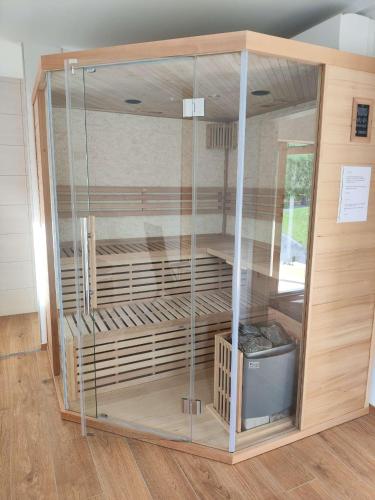 a large glass display case in a room at Casa Tara in Döbriach