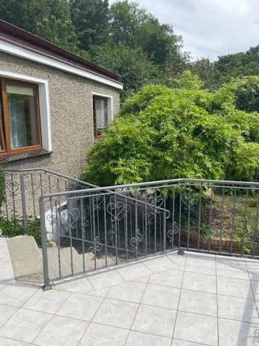 a metal gate in front of a house at Jezioranka in Skorochów