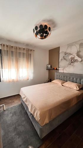 a bedroom with a large bed in a room at Kumbor Happy Place in Kumbor