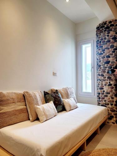 a large couch with pillows on it in a room at Artis Blue Relax in Himare