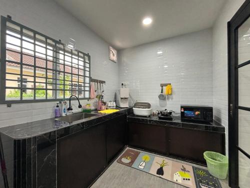 Η κουζίνα ή μικρή κουζίνα στο 126 Homestay TYPE C