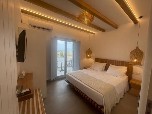 Postel nebo postele na pokoji v ubytování SOHOROS suites