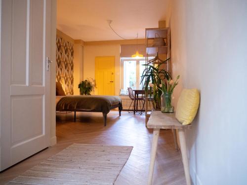 a living room with a bed and a table at BnB 117 in Amsterdam