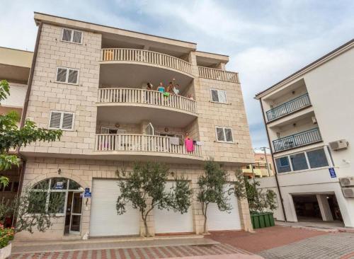 people on the balcony of a building at Holiday Home in Komarna