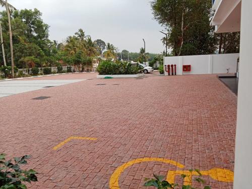 a red brick driveway with a number on it at Hybiz by Darshan in Anchal