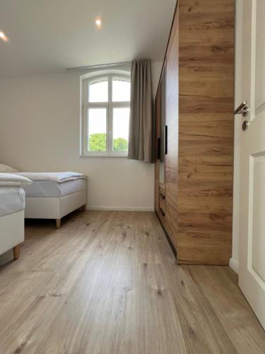 Katil atau katil-katil dalam bilik di Remise 23a - 2Schlafzimmer Unterkunft für 4-köpfige Familie