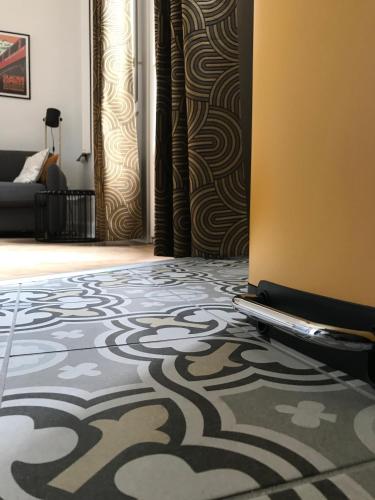 a room with a carpet on the floor and a door at Studio 329 in Aix-les-Bains