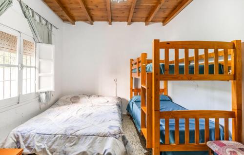 a bedroom with two bunk beds and a bed at 3 Bedroom Stunning Home In Cordoba in Córdoba