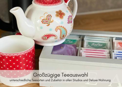 a tea pot and a cup on a shelf at Dein HimmelReich - Ruheoase im Almenland auf 1000m über'm Alltag in Kloster