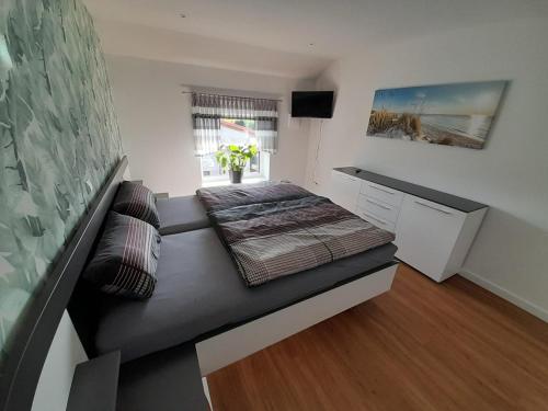 Ένα ή περισσότερα κρεβάτια σε δωμάτιο στο Exklusives Haus am See