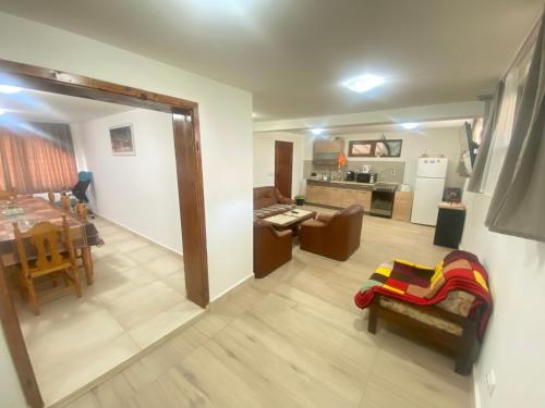 a view of a living room and a kitchen at Анелия in Sapareva Banya