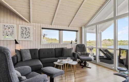 a living room with a couch and a table at A Stunning Home In Haderslev With 3 Bedrooms And Wifi in Haderslev