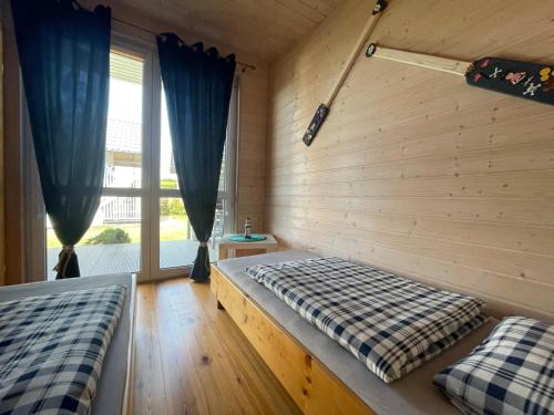 Postel nebo postele na pokoji v ubytování Domki Zuzanna