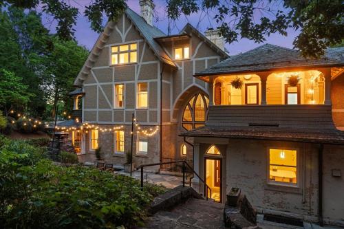 a large house with lights on the front of it at The Historic Inn at Oakdene in Staunton