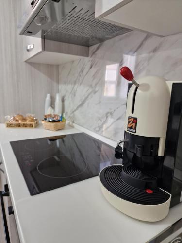 a coffee maker sitting on a counter in a kitchen at Casa Mia in Scilla