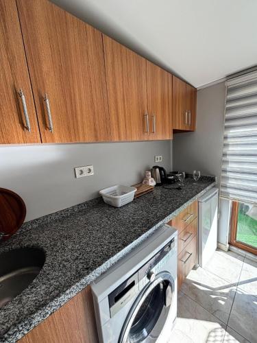 a kitchen with a washer and dryer on a counter at Moon Hostel in Istanbul