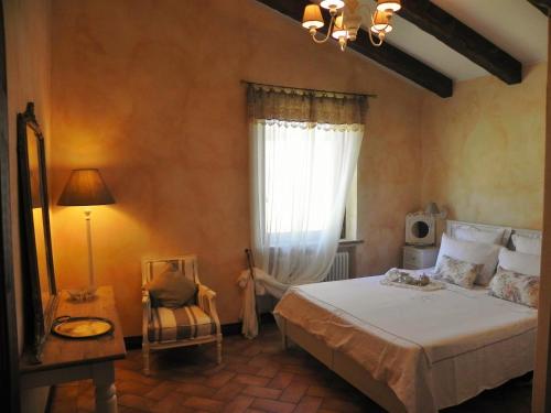 Agriturismo Sugheretelloにあるベッド