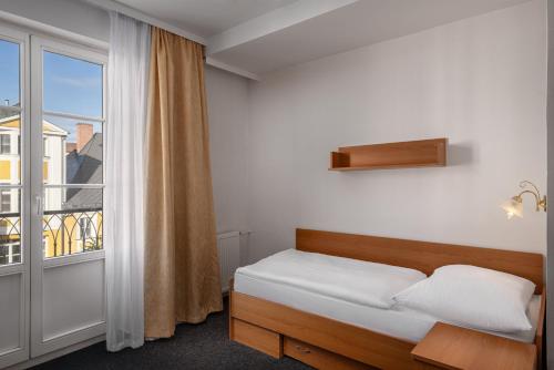 Postel nebo postele na pokoji v ubytování Spa Hotel Goethe
