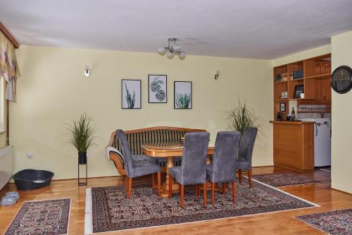 a dining room with a table and chairs at Nanki's Residence in Visoko