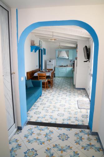 a hallway leading to a kitchen and a living room at Casa Serena in Lipari