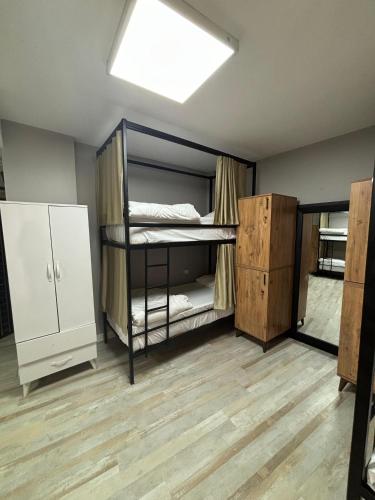 a dorm room with bunk beds and a skylight at Moon Hostel in Istanbul