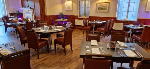 two views of a restaurant with tables and chairs at The Royal Hotel in Liverpool
