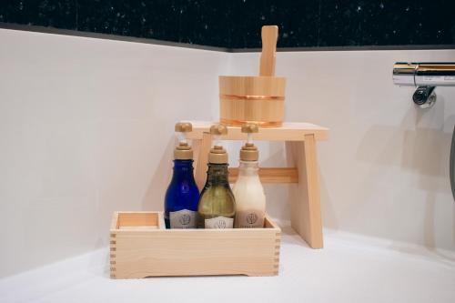 a wooden crate filled with bottles sitting on the floor at 閑雲庵 -Kan un an- in Ayagawa