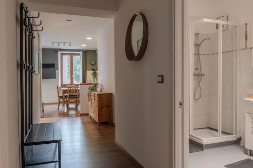 a hallway of a home with a shower and a bathroom at Le finestre sul Duomo in Trento
