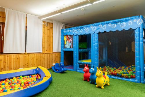 a play room with a bunch of balls at Hotel Negresco in Lido di Jesolo