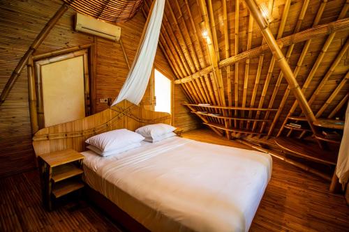 Ένα ή περισσότερα κρεβάτια σε δωμάτιο στο Cacao House 4bds Bamboo at Green Village Bali