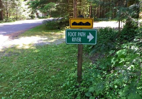 a sign that says root path ranger on a road at 77MBR - Wi-Fi - Fireplace - Pets Ok - BBQ cabin in Glacier