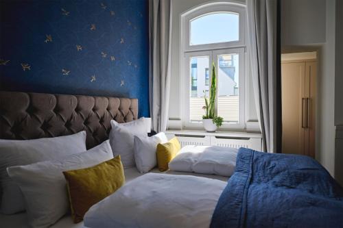 Postel nebo postele na pokoji v ubytování Goldmädchen 93 - Beach House