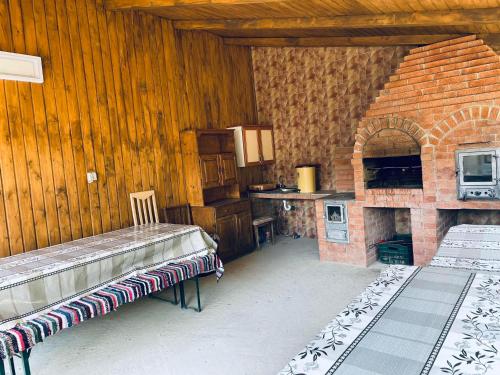 a kitchen with a brick oven in a room at Casa Daya Borsa in Statiunea Borsa