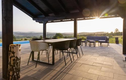 a table and chairs on a patio with a view at Amazing Home In Cetingrad With Wifi in Cetingrad