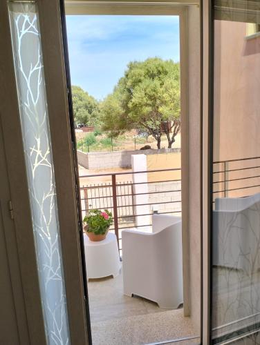 a sliding glass door with a view of a balcony at Lilly's house in Murta Maria