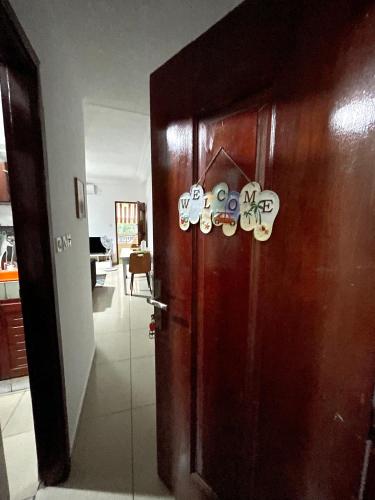 a door with tags on it in a room at Cheb's House in Abidjan