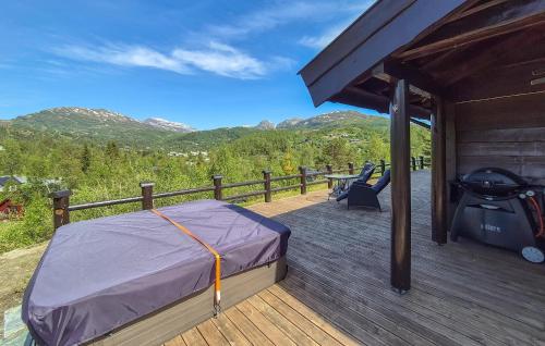 a bed on the deck of a cabin at 4 Bedroom Cozy Home In Norheimsund in Norheimsund