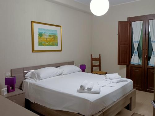 Postel nebo postele na pokoji v ubytování Villasimius Villa Agorà