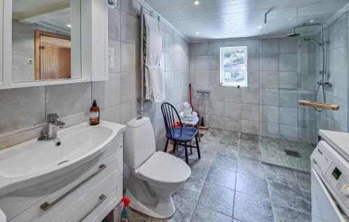 a bathroom with a toilet and a sink and a shower at 3 Bedroom Gorgeous Home In Tjörn in Knöde