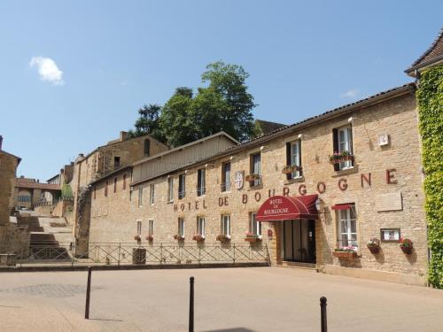a brick building with a sign that reads hotel be bourbononomous at Hotel de Bourgogne in Cluny