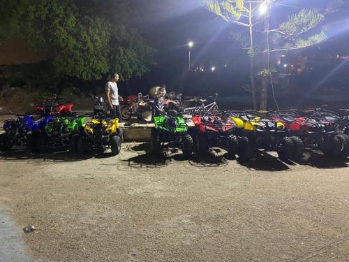 a group of motorcycles parked next to each other at Chalet 3 bedrooms 2 toilets lotus north cost stand alone 3 Ac 2 stand fan families are preferred in El Alamein