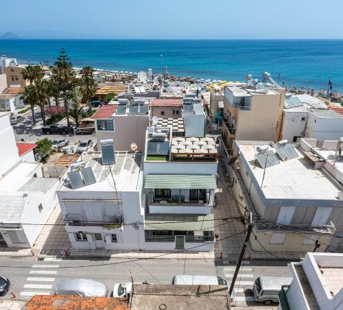 an aerial view of a city with the ocean at Casa Dell Artista with private jacuzzi in Kos Town