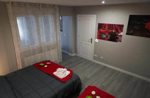 a bedroom with a bed with a towel on it at VILLA Formonte in Los Ángeles de San Rafael