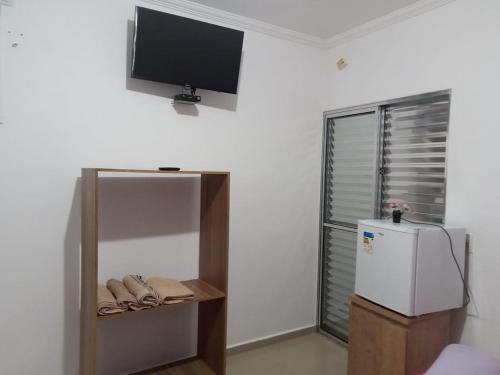 Μια τηλεόραση ή/και κέντρο ψυχαγωγίας στο Pesqueiro Restaurante e Pousada Pingo de Ouro