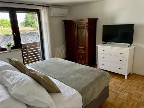 Postel nebo postele na pokoji v ubytování Apartma Tinkara